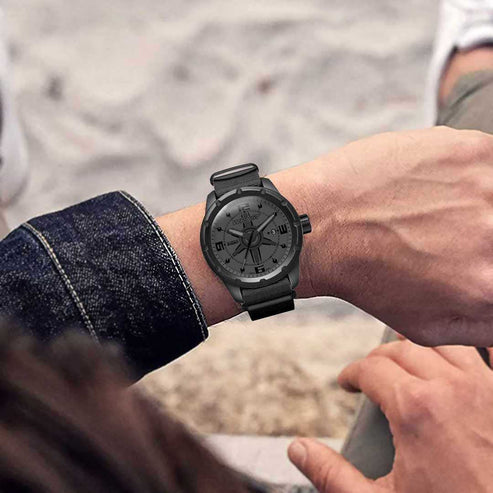 Black Swiss Wristwatch Showing on a Man's Wrist