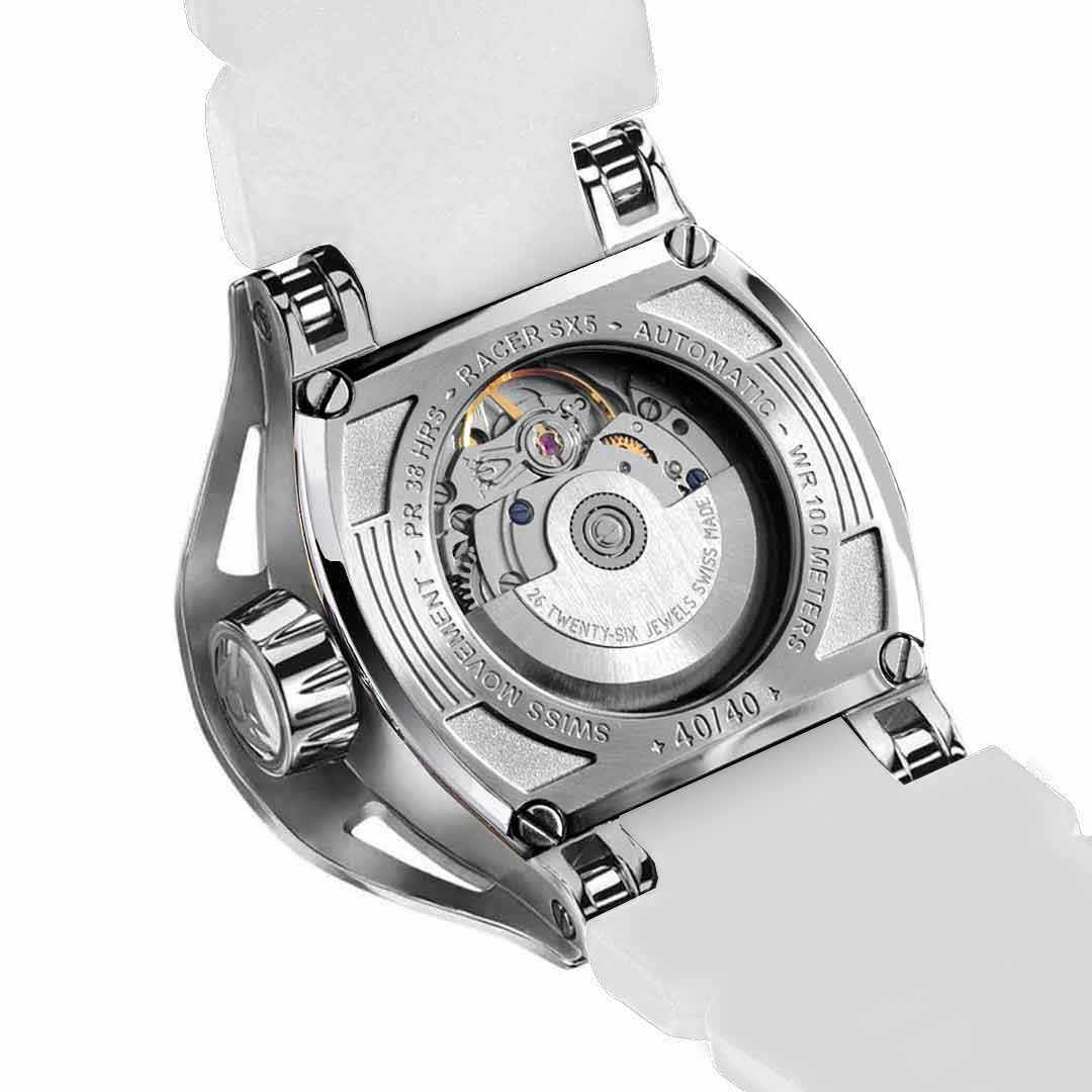 Close-up of a white watch with a visible mechanical movement