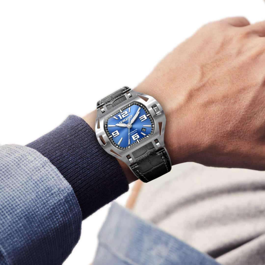 man wearing a stunning blue face automatic watch wryst