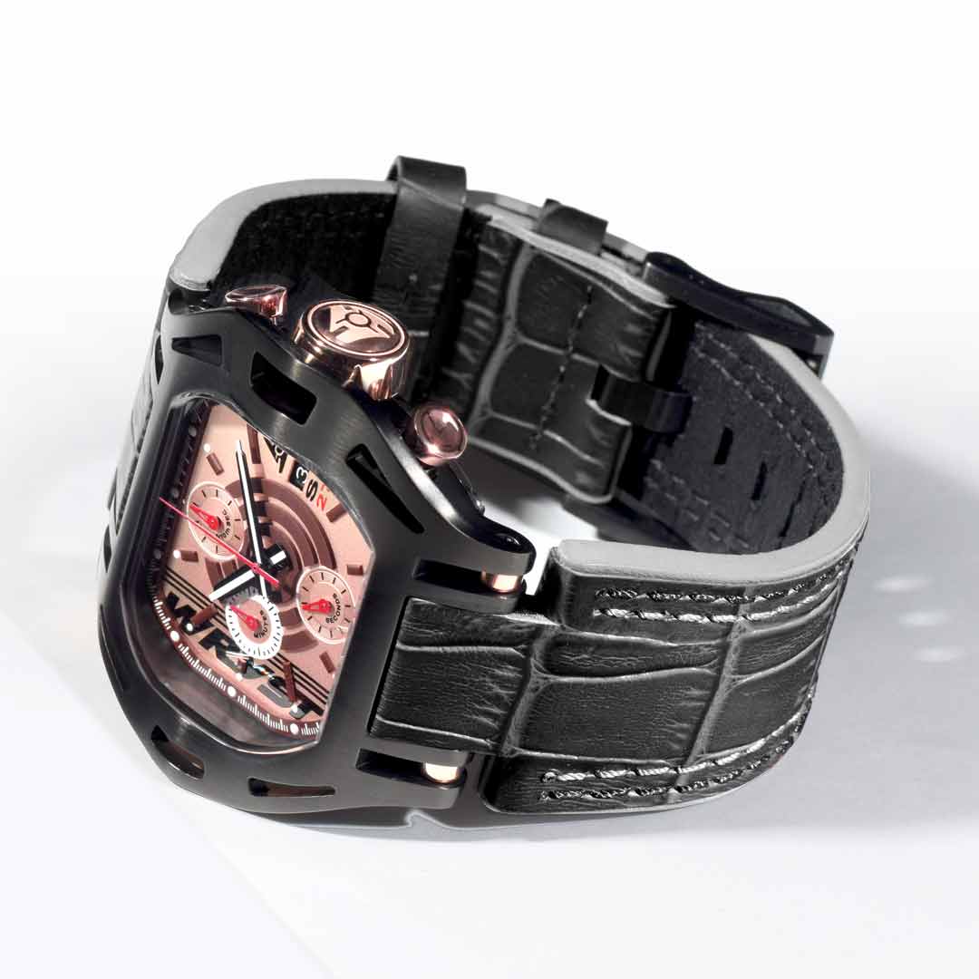 photography of a man wearing a black and gold watch