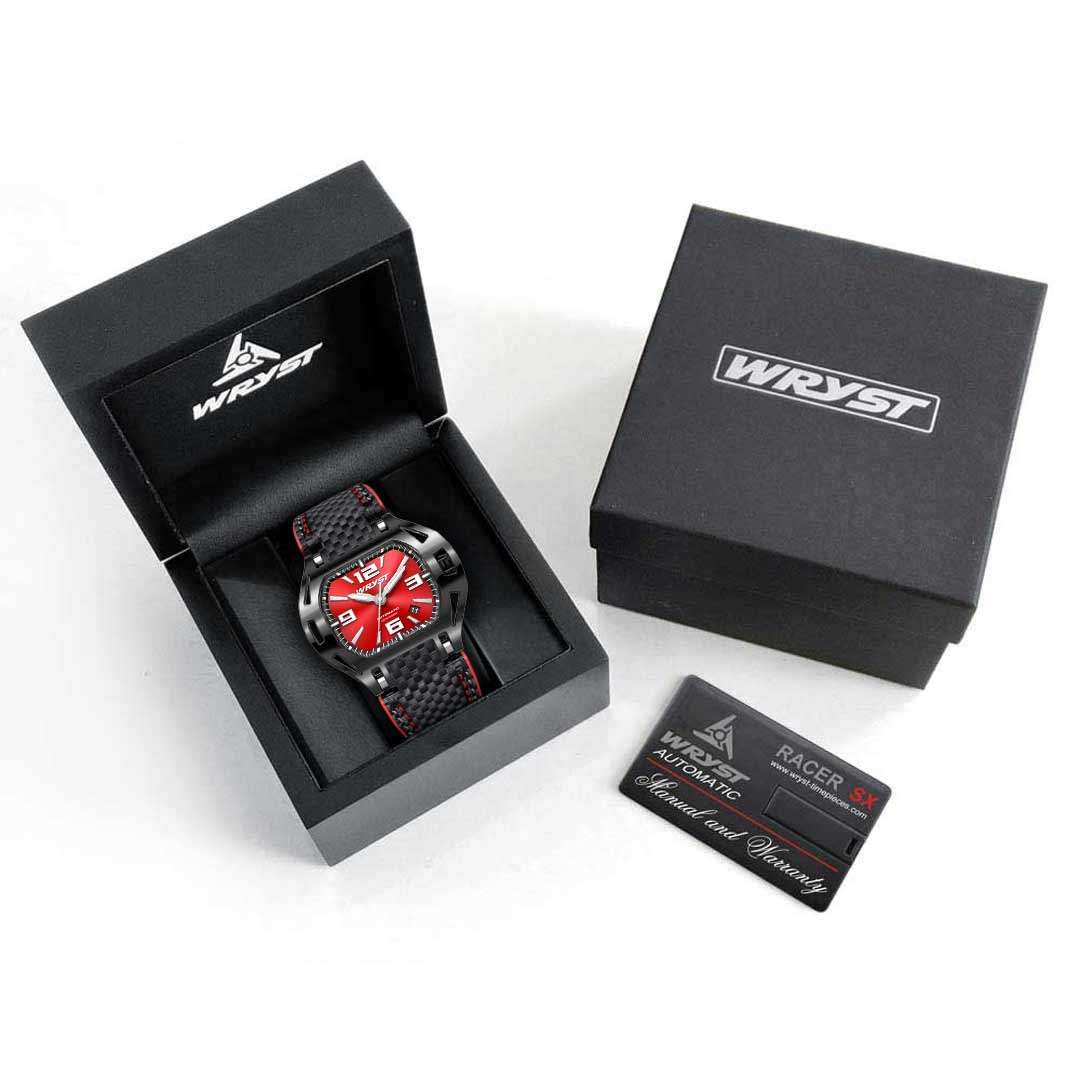 Wryst watch with red face and black strap in open box on a white background